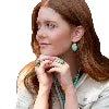 Woman wearing turquoise drop earrings
