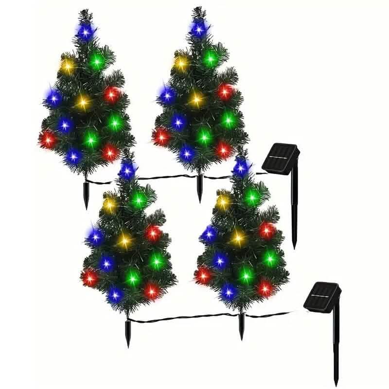 Four small pre-lit Christmas trees with colorful lights and solar panels on a white background.