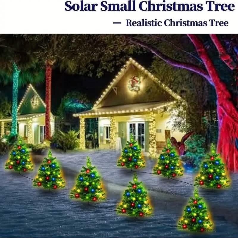 Small Christmas trees with lights on a driveway in front of a house