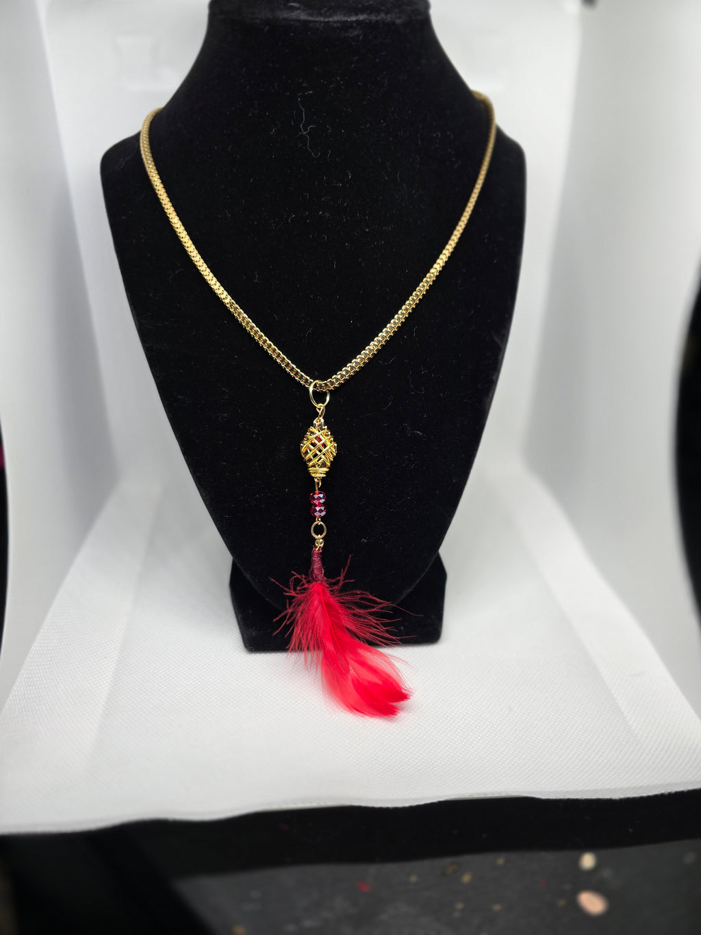 Golden Colored Diamond Shaped Basket Pendant With Red Feather on a Golden Color  Plastic Snake Chain