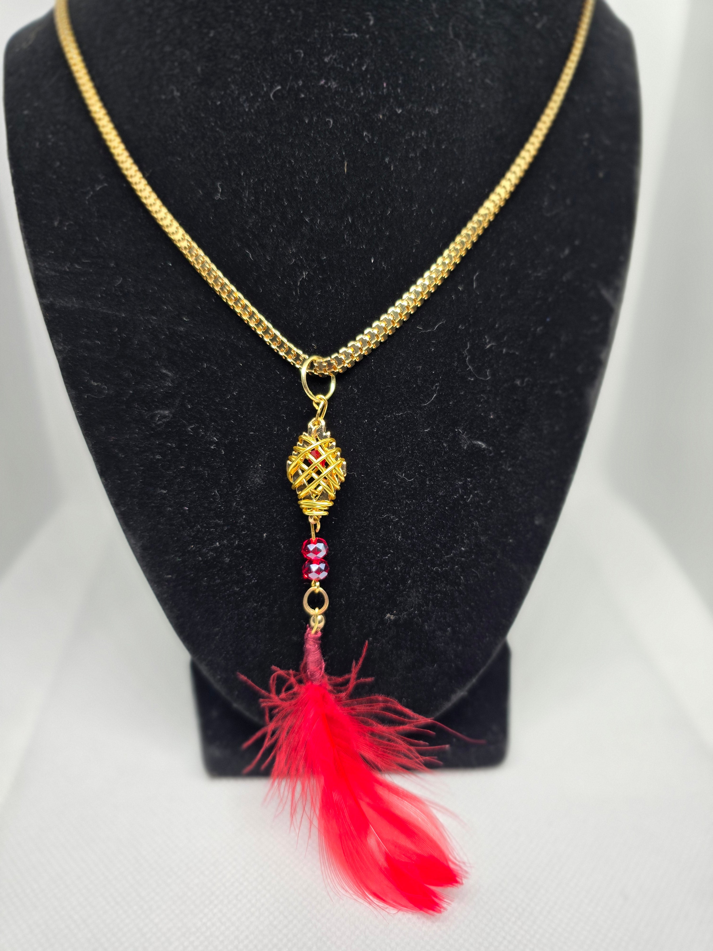 Golden Colored Diamond Shaped Basket Pendant With Red Feather on a Golden Color  Plastic Snake Chain